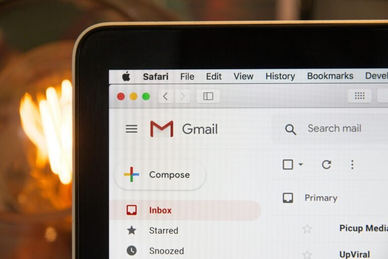 Laptop displaying Gmail for writing a job application follow-up email
