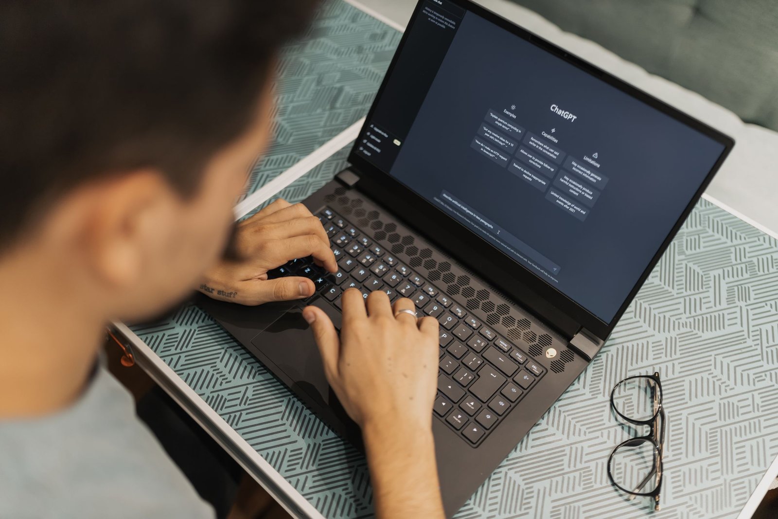 Someone using ChatGPT on a laptop, the hands-on AI practice that helps you land AI training jobs