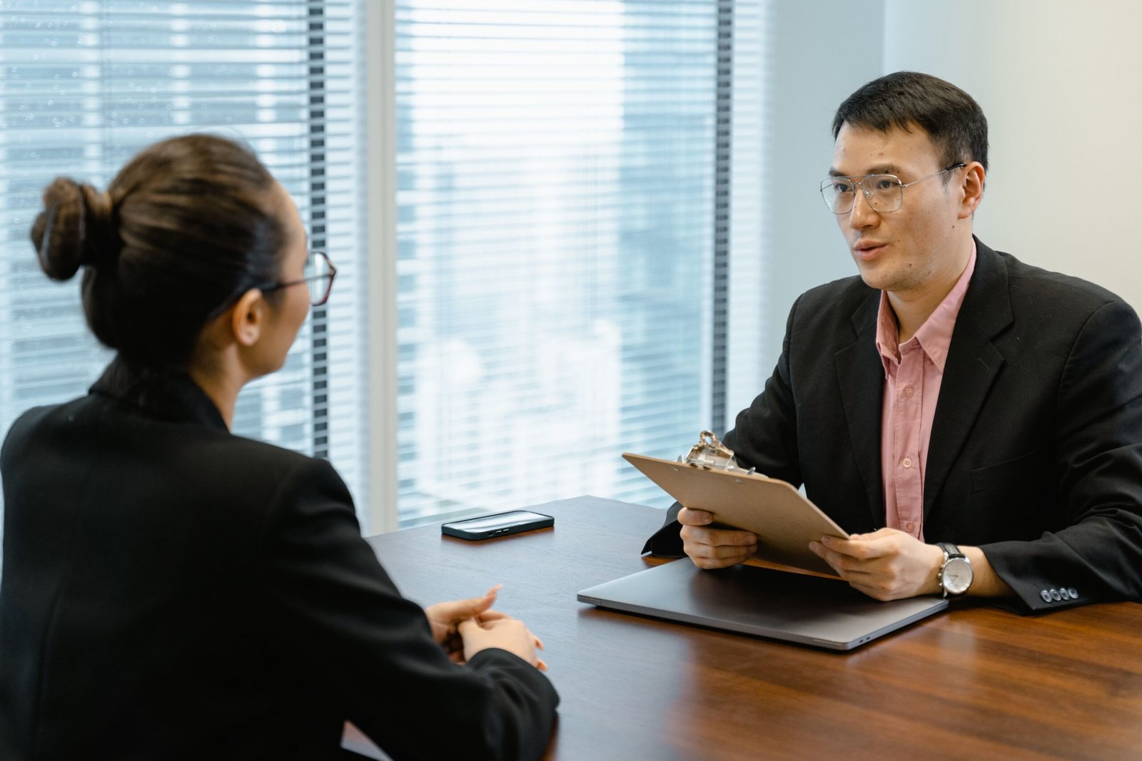 Employee having a one-to-one compensation discussion with a manager