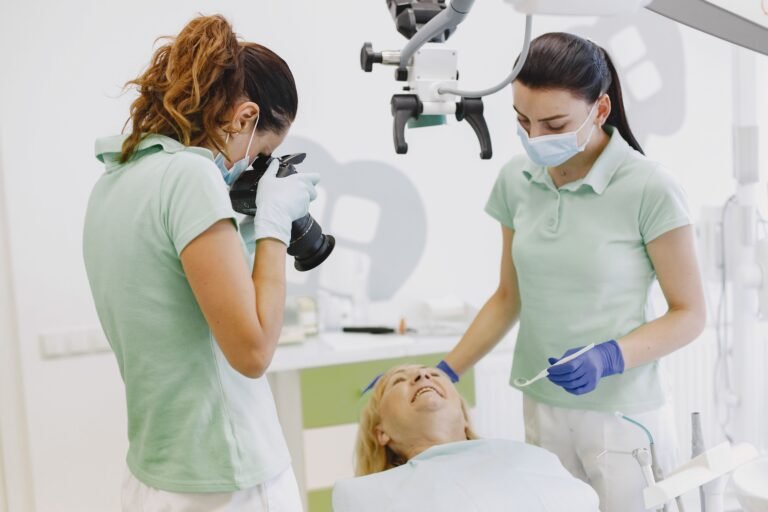 Dental professionals treating a patient in a bright clinic